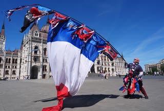 A PSG fan outside the Hungarian Parliament Building in Budapest